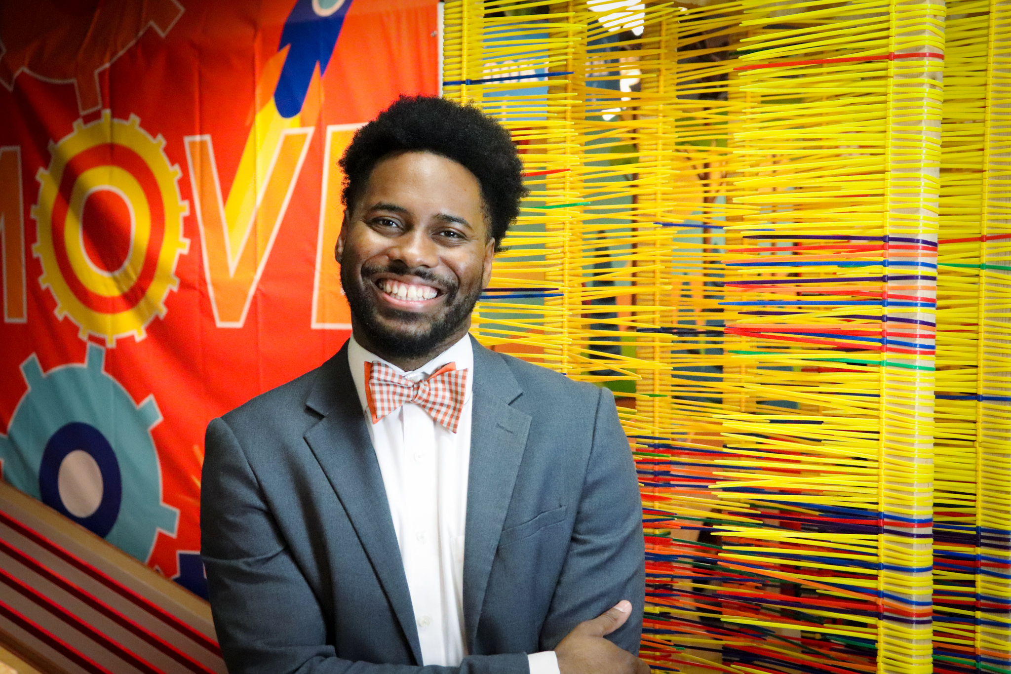 IMG_8728 Photo of smiling young black man wearing a suit and bowtie at Muse Knoxville