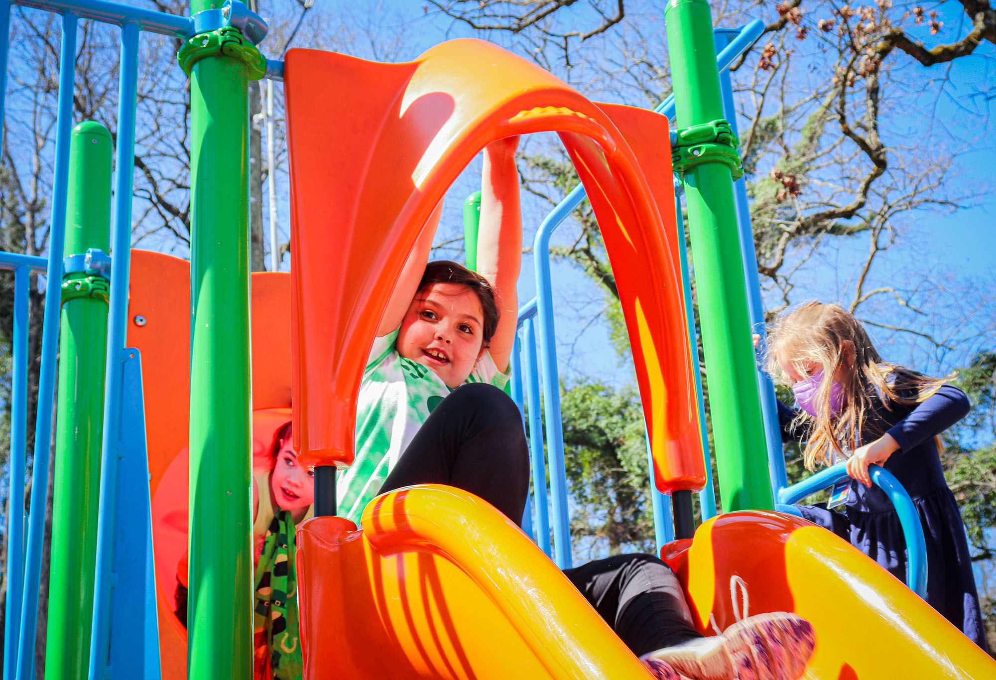 Two small children are playing inside a pretend spaceship