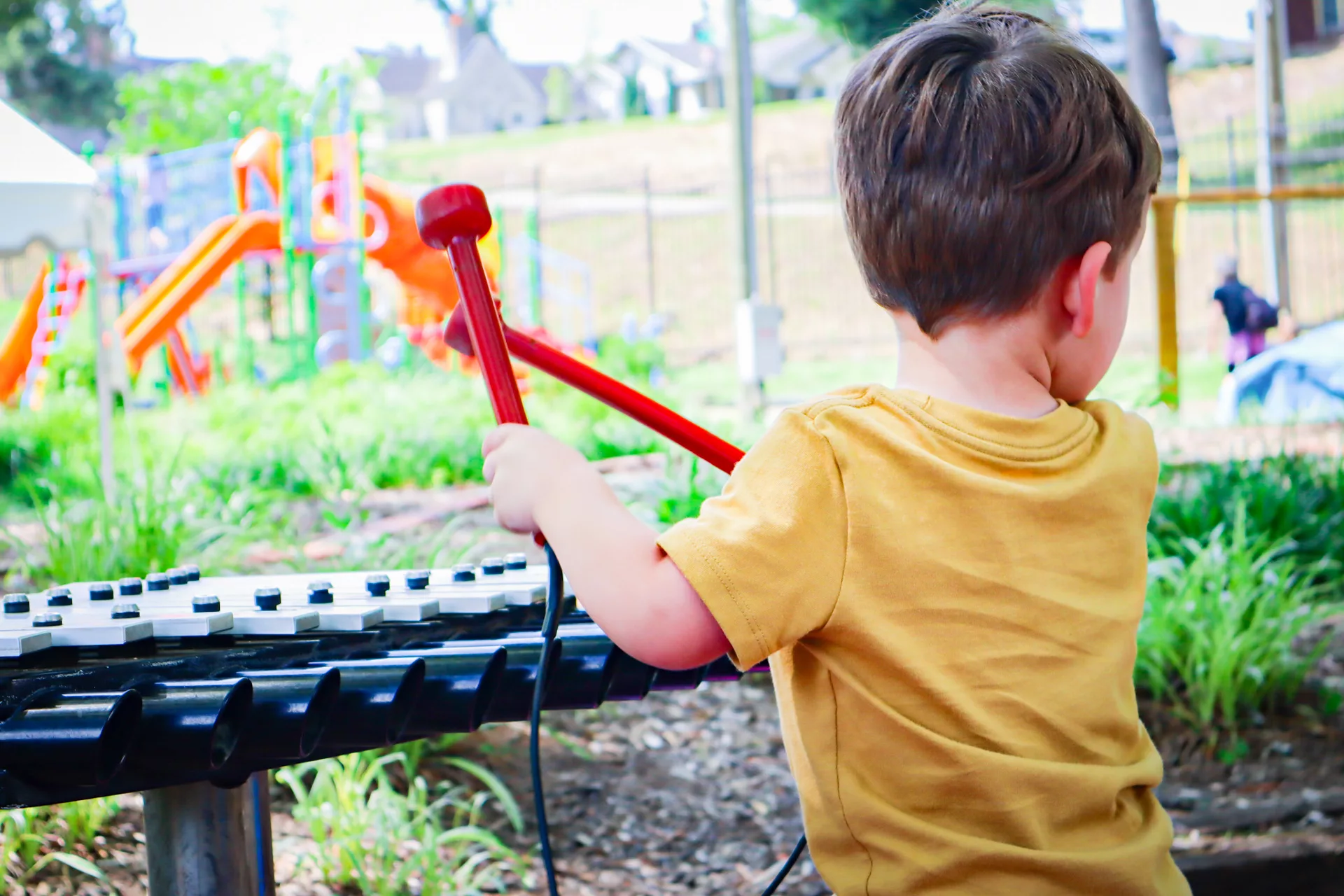 Two small children are playing inside a pretend spaceship