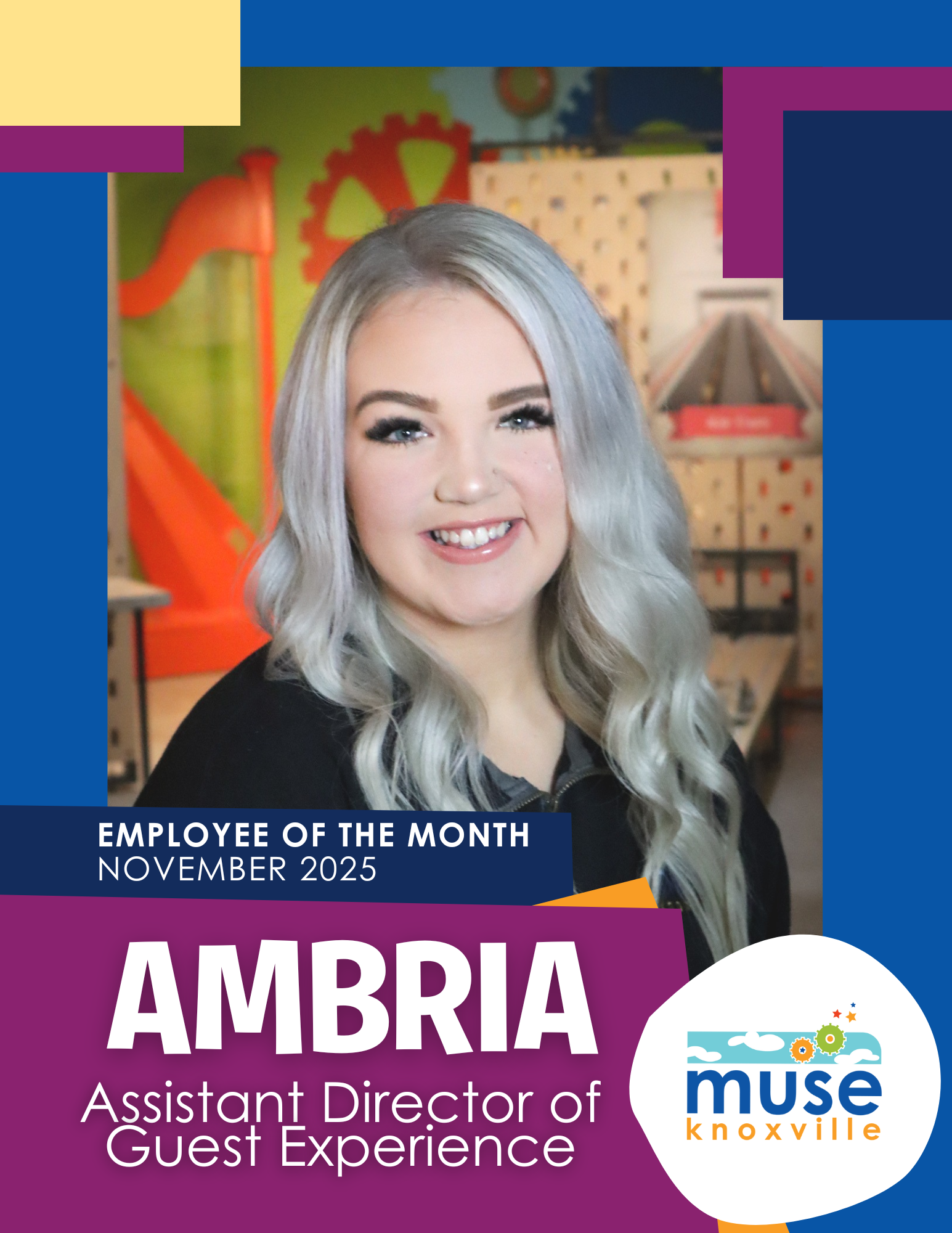 Photo of smiling young black man wearing a suit and bowtie at Muse Knoxville