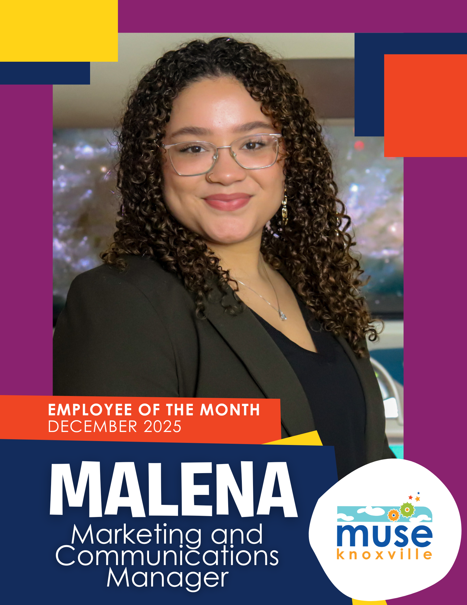 Photo of smiling young black man wearing a suit and bowtie at Muse Knoxville