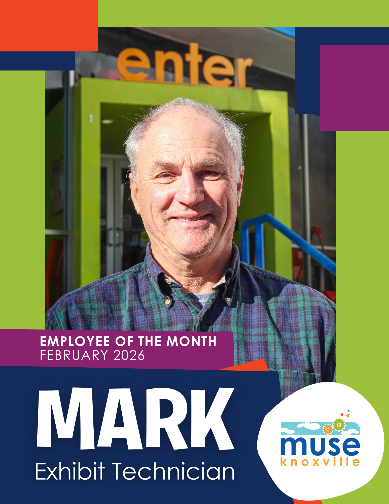 Photo of smiling young black man wearing a suit and bowtie at Muse Knoxville